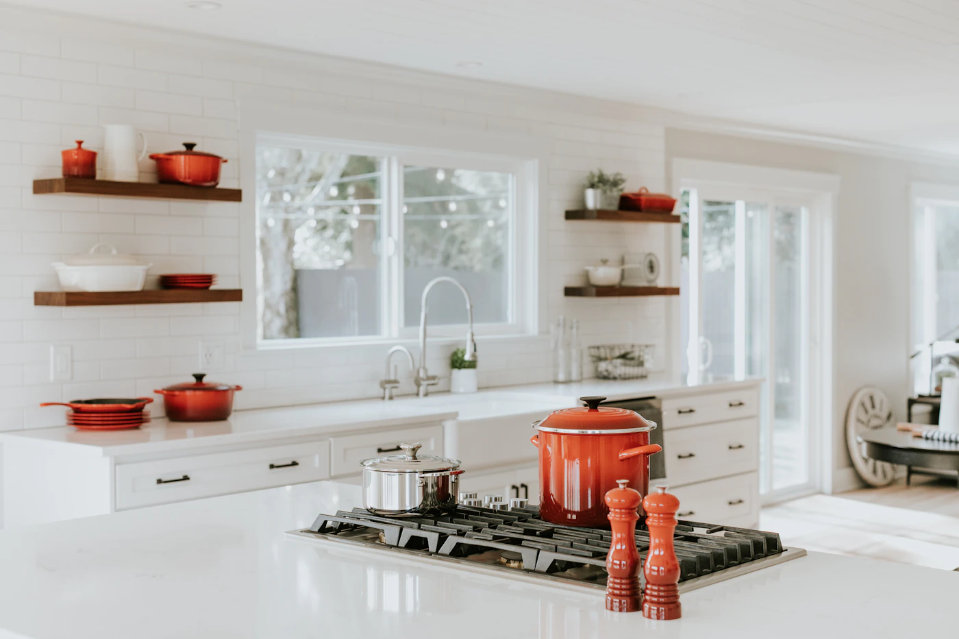 An everyday kitchen counter with cooking pots and tools